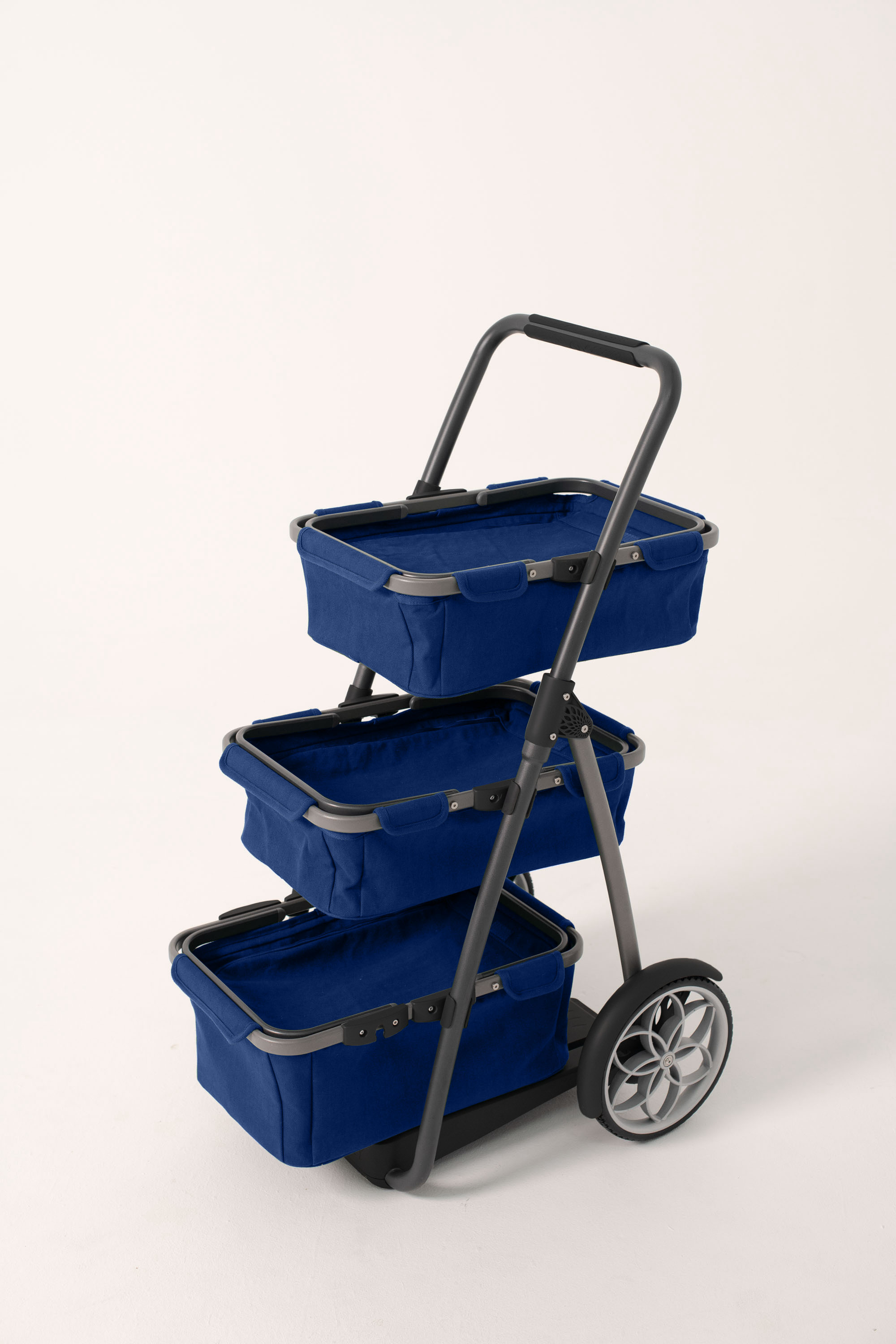 Three-tiered blue cart with wheels on a white background