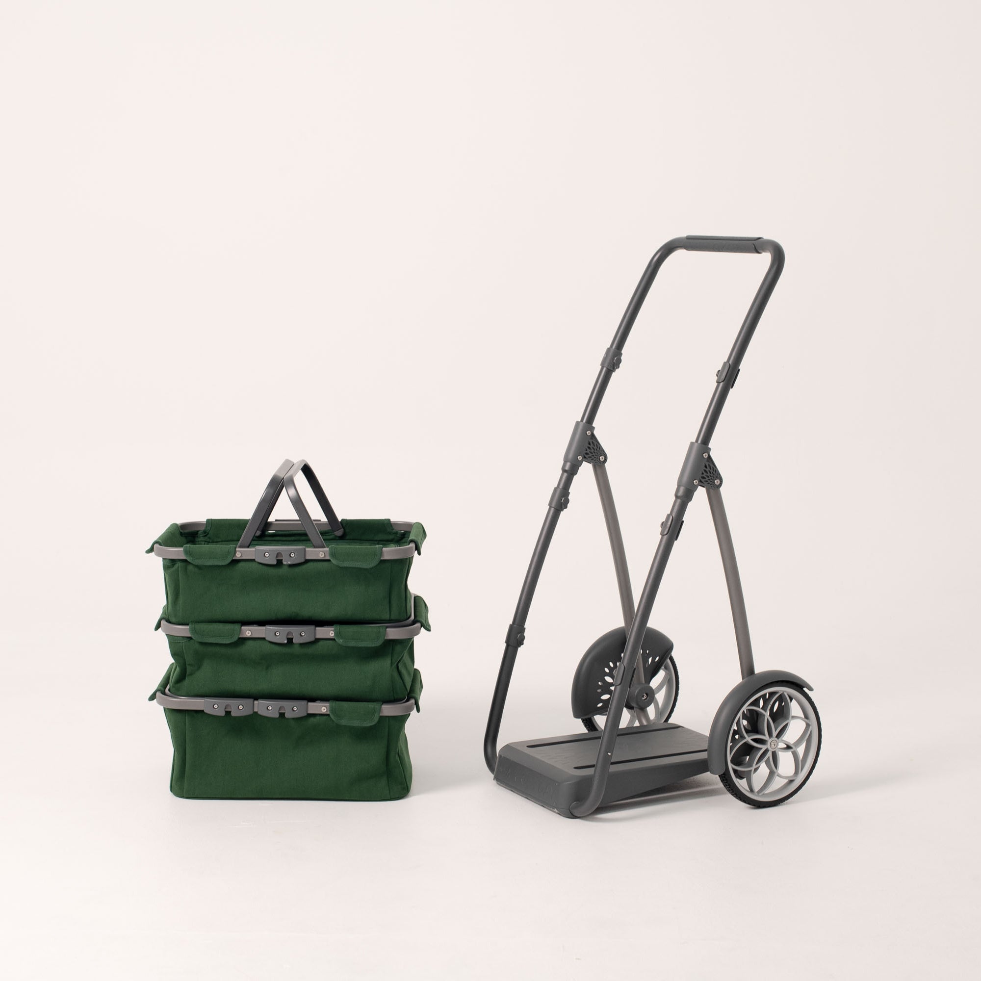 The marketday cart shown with the baskets stacked 3 high to the side of the frame.